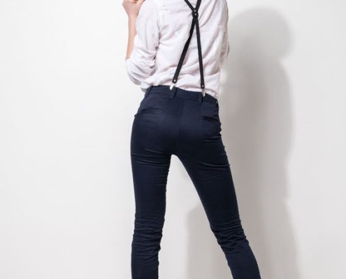 Rear view of woman modeling X-back suspenders