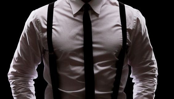 Model wearing black suspenders and tie