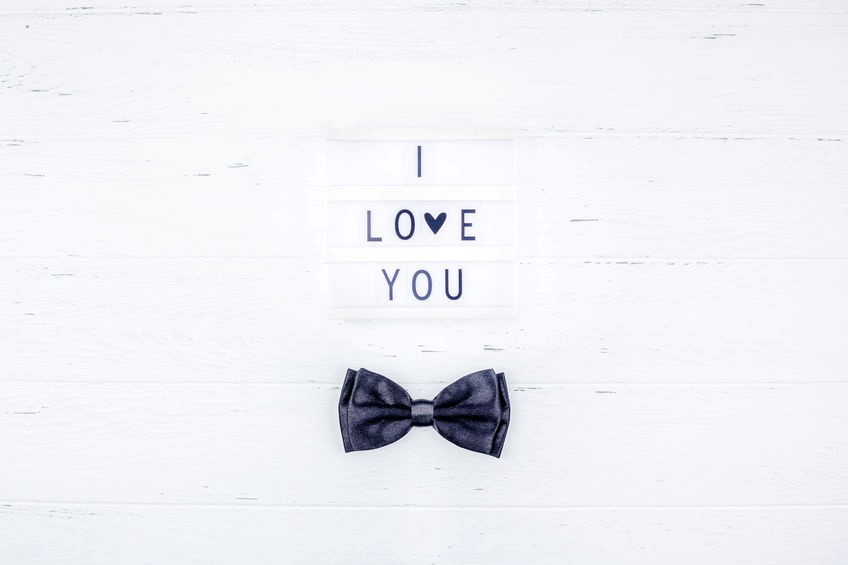 A casual Black Bow Tie and I Love You text
